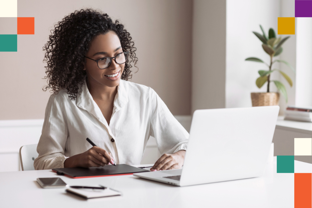 Smiling woman looking at laptop